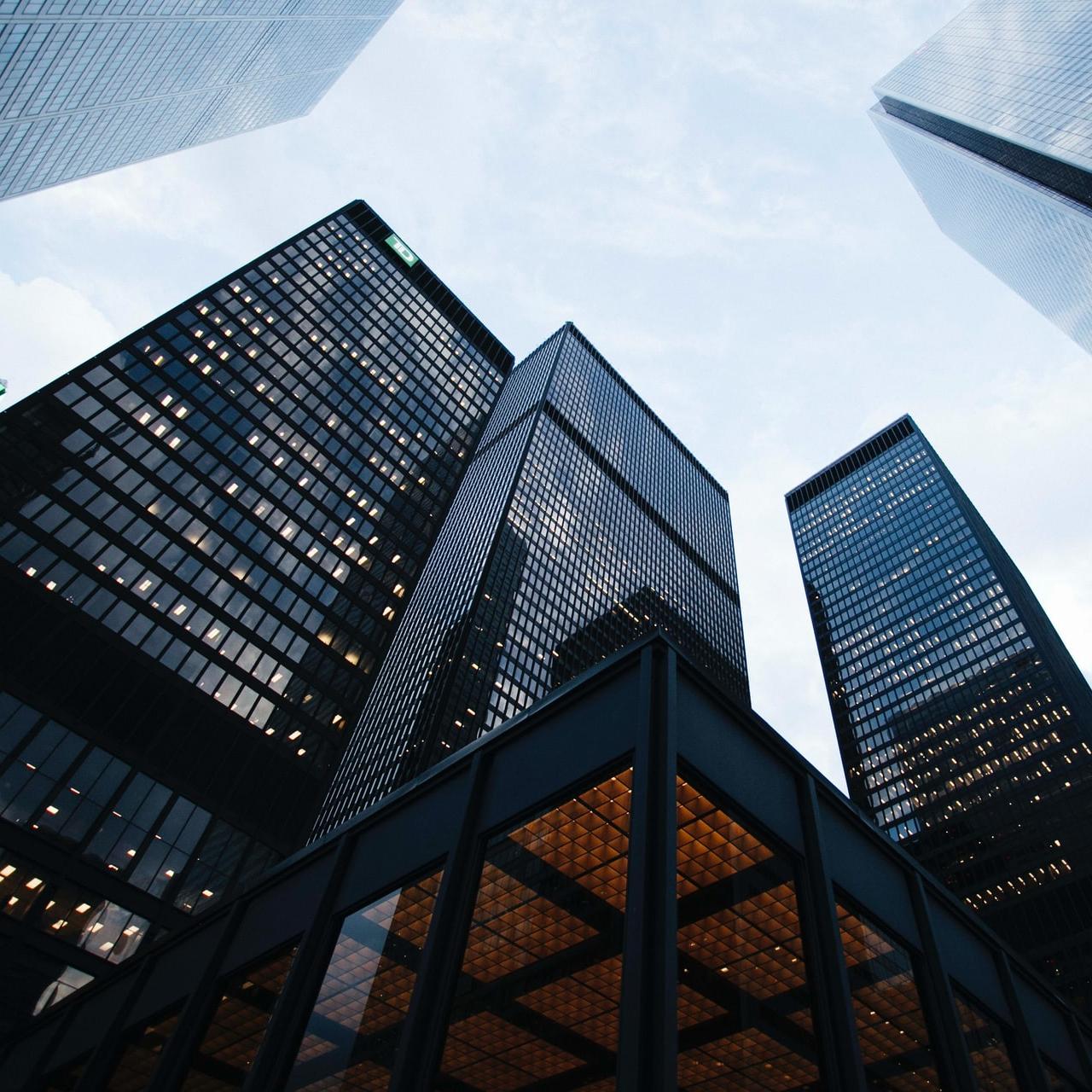 low angle photo of city high rise buildings during daytime